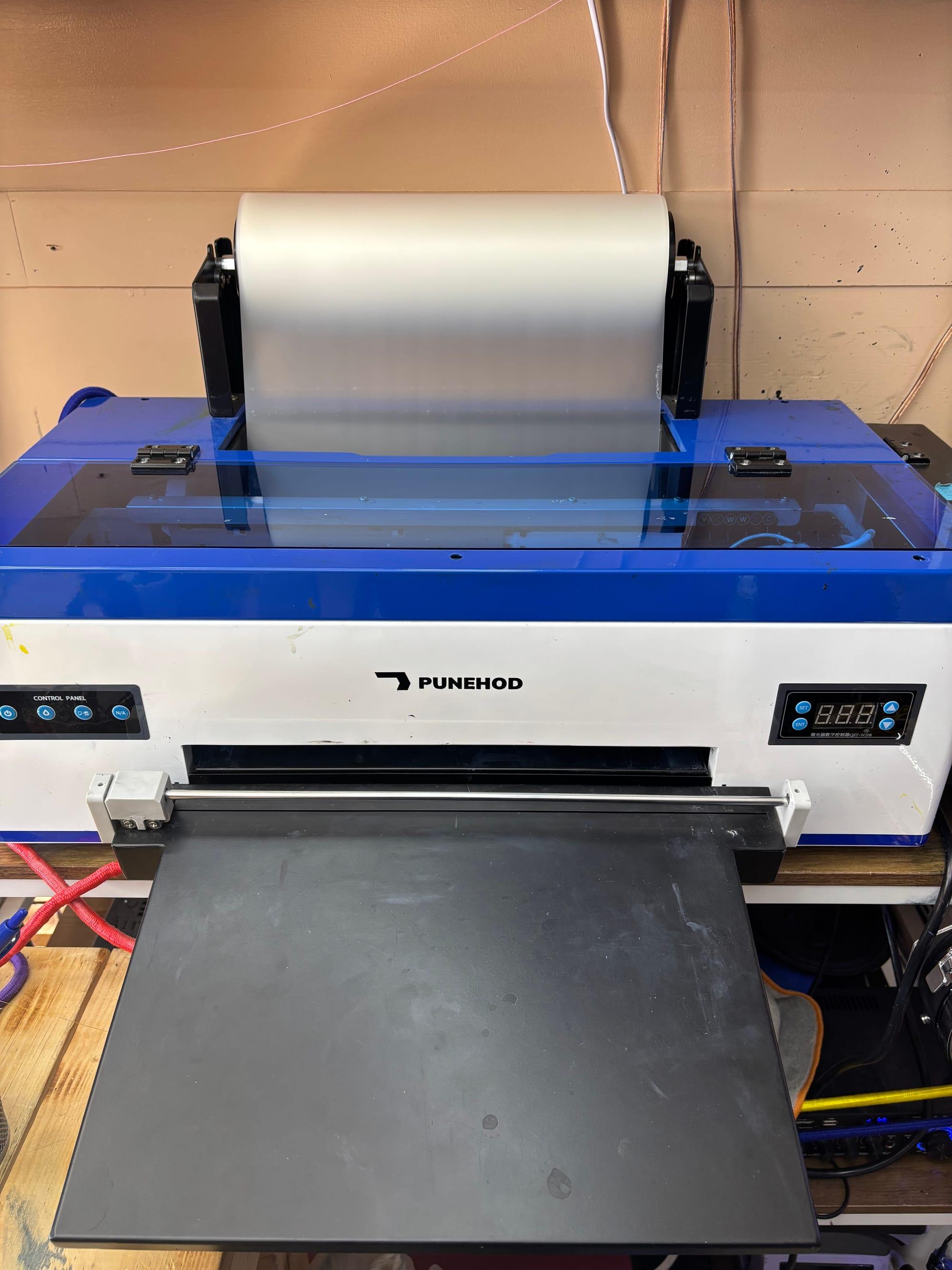 CR's DTF printing equipment with transfer film loaded
