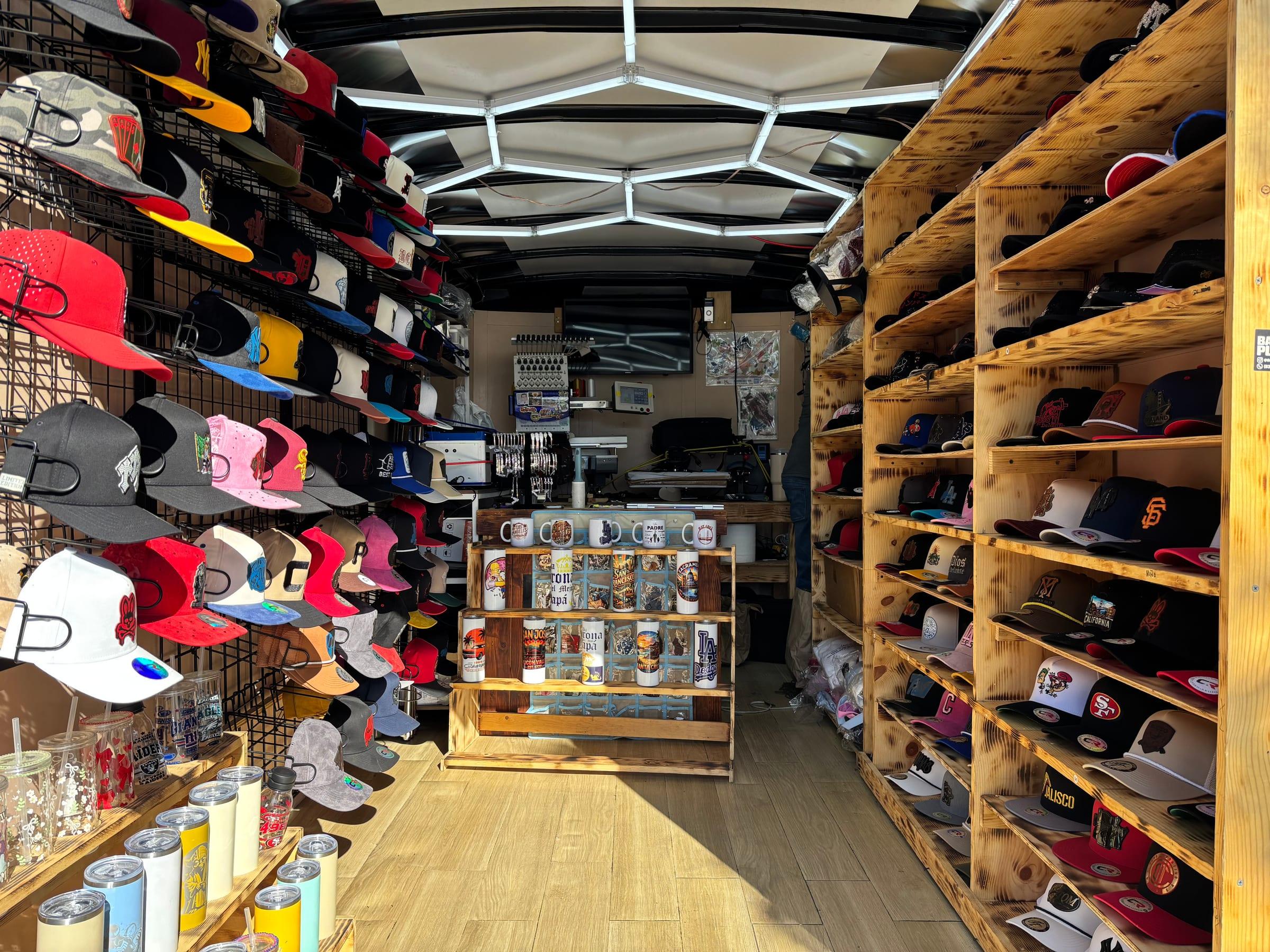 Inside CR's mobile workshop with custom hats, apparel, and production equipment