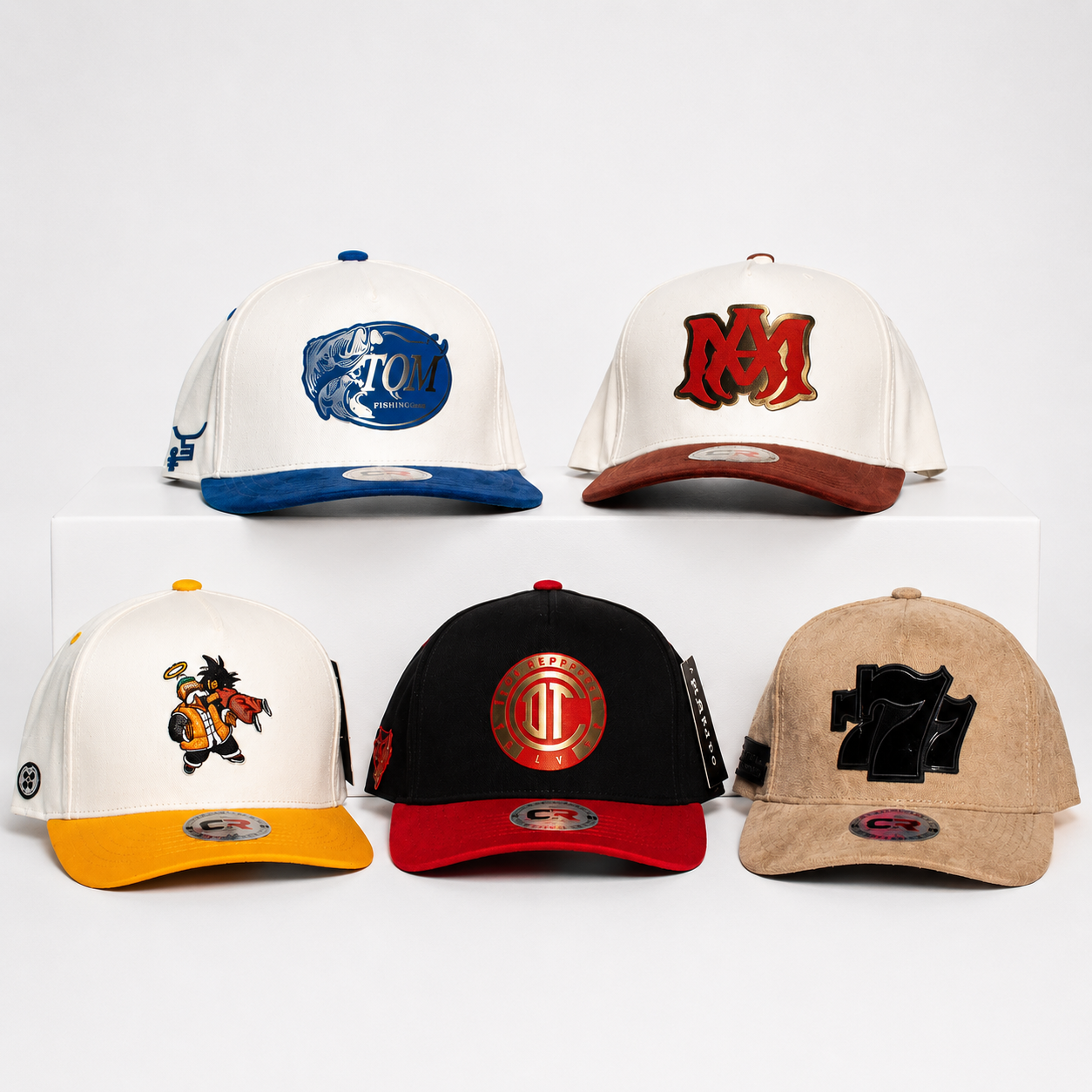 Five custom hats with embroidered and dimensional patch designs