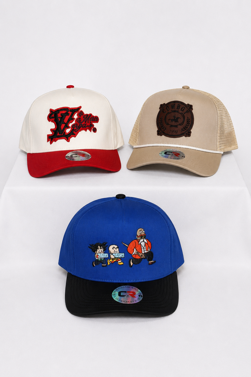 Three custom hats with embroidered and leather patch artwork