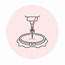 Embroidery needle stitching material in a hoop
